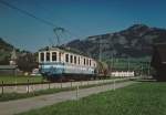 MOB/RBS: Zementverkehr Montreux-Saanen im Juli 2003. Die Zufuhren der beladenen Zementwagen ab Montreux sowie die Abfuhren des Leermaterials ab dem Bahnhof Saanen wurden jeweils den Regionalzügen mitgegeben. Das Rangiermanöver um Saanen wurde mit einem alten in Saanen stationierten Triebwagen abgewickelt. Rangierfahrt bei Saanen mit dem BDe 4/4 37 ex RBS/VBW  BLAUES BAEHNLI .
Foto: Walter Ruetsch