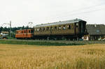 RBS/SZB Regionalverkehr Bern-Solothurn:  Erster Rollbockzug der damaligen SZB mit dem De 4/4 103 und einem Speisewagen der OeBB auf vier Rollböcken.