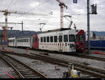 tpf - Reserve Pendelzug an der Spitze der Triebwagen Be 4/4 122 + B 215 sowie am Schluss der Steuerwagen ABt 222 abgestellt im Bahnhof Bulle am 19.12.2020