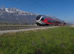 Mit Blick auf die Berge des Alpsteins begegnete dem Fotografen am 07.03.2014 bei Salez-Sennwald ein Stadler-FLIRT der Sdostbahn, unterwegs als S4 23443 von Uznach ber St.