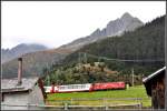 GlacierExpress 902 mit Hge 4/4 II 103 bei Sedrun.