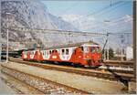 In Martigny wartet ein Regionalzug nach Le Châble auf die Abfahrt. Triebfahrzeug ist ein  EAV  ABDe 4/4, an der Spite des Zuges ist der dazu passende Bt eingereiht. 

Analogbild vom März 1998

