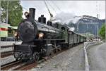 Dampfextrazug 2056 nach Landquart mit G 4/5 107  Albula  verlässt Klosters Platz.