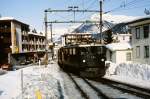 Ge 4/4 I 608 mit Schnellzug der RhB bei der Einfahrt in Davos Platz im Februar 1984.