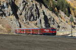 RhB Ge 4/4 III 647  Grüsch  auf dem Weg nach St. Moritz am 26. Oktober bei Celerina 
