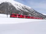 Die Allegra ABe 8/12 3514 (leer) mit 4 leerwagen (mitteleinstiegwagen fr schlittelzugen Bergn-Preda) und 2 gterwagen Gak-v. Zwischen Bever uns Samedan - 06-02-2013