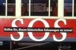 RhB - As 1144 am 09.07.1997 in Scuol - Historischer 1.Klasse Salonwagen 4-achsig - Detailansicht: Werbung: SOS, gescanntes Dia  