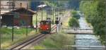 Entlang der Landwasser verluft die Strecke nach Davos Frauenkirch. Tm 2/2 116 bringt einen Containerwagen zur Kehrichtverladestelle im Bildji. (25.06.2009)