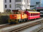 RhB - Ge 3/3 215 mit Personenwagen bei Rangierfahrt im Rangierbahnhof von Chur am 25.03.2012 ..