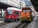 RhB - Regio nach Thusis mit dem ABe 4/16  3103 und Rangierlok Ge 3/3 215 im Bahnhof Chur am 20.01.2013
