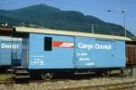 RhB - Xk 9012 V am 22.06.1994 in Landquart - Transportwagen zwischen ME und GE - Werbung: Cargo Domicil - 2-achsig mit 2 offenen Plattformen - Baujahr 1897 - SIG - Gewicht 8,00t - Ladegewicht 7,00t -