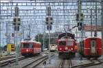 Ausfahrender Be 4/4 513 und einfahrender Rollschemelzug mit Ge 4/4 I  Madrisa  in Chur.