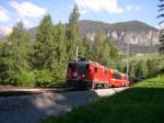 Ge 4/4 II 612  Thusis  befrdert am 11.06.2006 den   D 951  Bernina-Express  Chur-Tirano an dieser romantischen Stelle kurz vor Filisur.