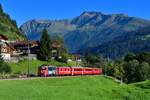 Ge 4/4 II 615 mit einem Regio am 04.09.2019 bei Serneus.