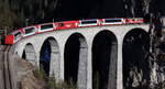 Ge 4/4 II 629 mit dem Glacier Express 902 (Zermatt - St.Moritz) auf dem Landwasserviadukt.

Filisur, 20. Februar 2020