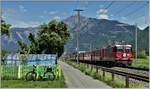 RE1749 nach Disentis mit Ge 4/4 II 613  Domat/Ems  bei Felsberg. (10.05.2020)