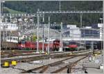 Ge 4/4 II 612  Thusis  mit RE nach Disentis, Ee 3/3 16428 und SBB Steuerwagen im westlichen Gleisvorfeld in Chur. (30.09.2007)