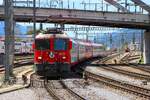 RhB Ge 4/4 II  615 am 06.07.26 in Chur mit einen Glacier Express