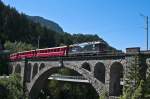 RhB Ge 4/4 II 619  Samedan  mit Werbung fr 100 Jahre Berninabahn am 8. August 2010 auf dem Soliser Viadukt.	