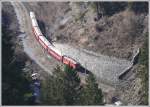 RE1245 mit Ge 4/4 II 620  Zernez  unterhalb von Trin bei der Einfahrt in den Dabi Tunnel, fotografiert vom Ruinaulta Wanderweg. (09.02.2011)