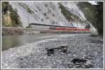 RE 1240 mit Ge 4/4 II 619  Samedan  bei Trin. (14.04.2011)