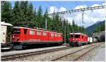 5129 mit Ge 6(6 II 702  Curia  kreuzt den 5140 mit Ge 4/4 II 631  Untervaz  in Muot. (18.07.2013)