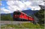 RE1232 mit Ge 4/4 II 614  Schiers  hat soeben den Vorderrhein zwischen Reichenau und Trin überquert. (01.05.2014)