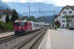 Glacier Express 902 auf der Fahrt von Zermatt nach St. Moritz am 1.8.15 in Domat Ems, gezogen von der Ge 4/4 ii 629  Tiefencastel .