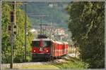 RE1228 mit der Ge 4/4 II 627  Reichenau-Tamins  von Scuol-Tarasp nähert sich Landquart. (01.09.2015)