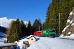 Ge 4/4 III 647 mit einem Regio am 14.02.2017 bei Davos Dorf.