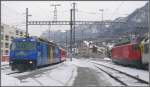 460 099-5 mit EC100 nach Hamburg fhrt ab und Ge 4/4 III 652  Vaz/Obervaz) macht sich bereit fr den RE1129 nach St.Moritz.