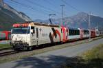 Die Ge 4/4 III 649  Lavin  zieht nun den Glacier-Express, von Chur kommend, kurz vor dem Bhf. Reichenau-Tamins. 17.4.2011