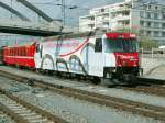  Unesco Lok  Ge 4/4 III 650 mit einem RE bei der Einfahrt in Chur.18.03.07