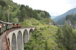 Jubiläum,125 Jahre RhB.Museumslok Ge4/6 Nr.353(1914)und Ge6/6 I Nr.415(Krokodil 1929)mit einem Nostalgiezug im Landwassertal.Im Hintergrund der gleichnamige Viadukt..24.07.14 