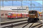 ABe 4/16 3102 und Ge 6/6 I 414 in Landquart.