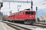 RhB Ge 6/6 II Nr. 703  St. Moritz  schleppte am 21. Februar 2018 den Berninatriebwagen ABe 4/4 III Nr. 54  Hakone  (wahrscheinlich von Landquart in Richtung  Heimat . Der Güterzug legt dabei im Bahnhof Thusis einen kurzen Halt ein, als ich zufällig diese Komposition aus einem Interregio sichtete und beim Halt dann die Momentaufnahme schoss. 
Glücklicherweise erwischte ich in letzter Sekunde noch meinen Zug nach Chur ;-) .