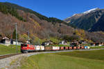 Ge 6/6 II 707 mit einem Güterzug am 03.11.2017 bei Klosters Dorf.