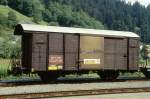 RhB - Gbk-v 5574 am 27.08.1997 in Ilanz - Gedeckter Gterwagen 2-achsig mit 1 offenen Plattform - Werbung: DIE POST - Baujahr 1913 - Reich - Gewicht 6,97t - Zuladung 12,00t - LP 8,49m - zulssige