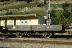 RhB - Kkl 7045 am 30.08.1993 in Poschiavo - Niederbordwagen 2-achsig mit 1 offenen Plattform - Baujahr 1903 - MAN - Gewicht 5,00t - Zuladung 10,00t - LP 7,49m - zulssige Geschwindigkeit Aufkleber 60/B km/h - =13.08.1993 - Lebenslauf: ex M 1175 - 1911 M 7045 - 1969 Kkl 7045 - 05/1995 Xk 9330.
