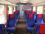 Rhtische Bahn 2008 - Auch bei der RhB wird auf Teufel komm raus modernisiert. Dieser 1. Klasse Wagen am 07.06.2008 im RE 1257 von Disentis nach Scuol Tarasp hat neue Sitzbezge, Wandverkleidungen und eine Fahrgast-Informationsanlage  erhalten. Ein Teil der Wagen besitzt bereits auch elektronische Zuglaufschilder.