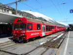 RhB - Regio nach Pontresina mit dem Steuerwagen BDt 1757 an der Spitze im Bahnhof Samedan am 07.04.2010