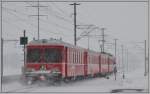 S1 1518 mit Steuerwagen 1712 im Schneegestber bei Zizers Altlser.