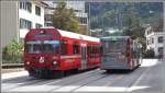 R1444 mit Bt1754 kreuzt einen Stadtbus am Kreisel der Engadinstrasse in Chur. (02.09.2015)