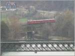 Be 4/4 516 Pendel nach Rhzns auf der Hinterrheinbrcke bei Reichenau-Tamins. Die Brcke im Vordergrund ber den Rhein dient dem Strassenverkehr (mit Gewichtslimite). (01.04.2008)