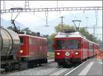 Ge 6/6 II 706 kreuzt in Untervaz mit dem Be 4/4 516 Regionalzug nach Schiers.