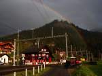 Bahnhof Langwies mit doppel Regenbogen (das zweite ist ein wenig schwächer).