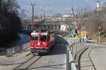 Regio mit Ge 4/4 II 629 nach Arosa am 06.03.11 beim Depot Sand in Chur.Im Hintergrund von l.n.r.die Martinskirche,Kathedrale u.Priesterseminar.