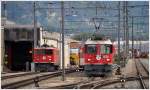 Ge 6/6 II 705  Pontresina/Puntraschigna  und einfahrender RE 1261 mit Ge 4/4 II 632  Zizers  in Landquart.