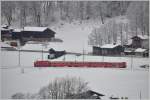 RE1335 mit Ge 47/4 II 612  Thusis  nach St.Moritz unterhalb von Klosters Dorf.