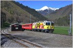 RE1049 mit Ge 4/4 II 611  Landquart  ist auf dem Weg nach Scuol-Tarasp bei der Dienststation Fuchsenwinkel zwischen Schiers und Furna/Pragg Jenaz.